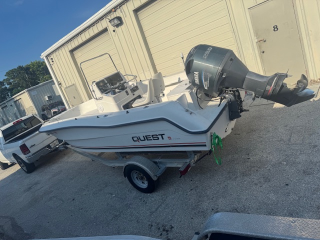 Completed white Quest center console boat after restoration